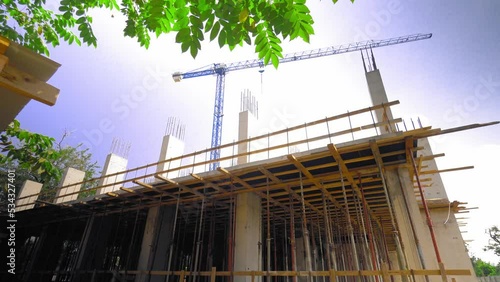 mounts on monolithic structure. Construction concept. Supports of monolithic floor formwork at construction site. Telescopic props for concrete flooring. Construction of modern apartment building photo