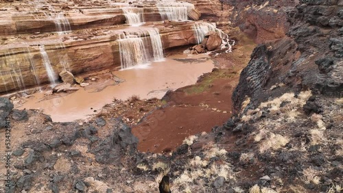 Aerial view of a person standing at Grand Falls and Little Colorado river, Leupp, Arizona, United States. photo