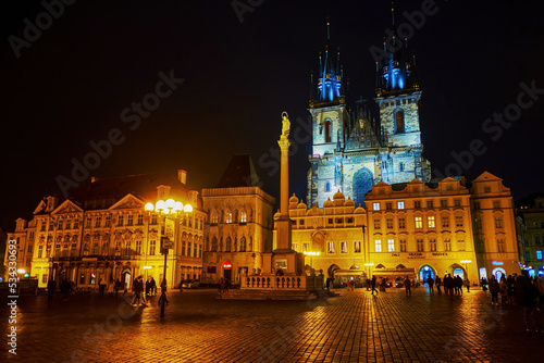 Panorama of Staromestske namesti square with bright Tyn church in bright night illumination, Prague, Czech Republic photo