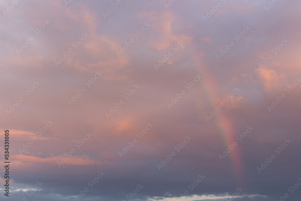 Rainbow in the cloudy sky