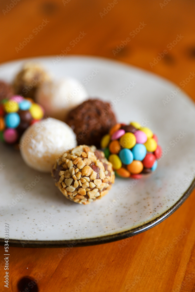 Table with brigadeiro and various party sweets. Image with selective focus Table with brigadeiro and various party sweets. Image with selective focus