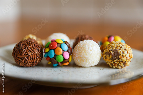 Table with brigadeiro and various party sweets. Image with selective focus