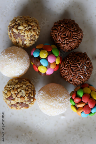 Table with brigadeiro and various party sweets. Image with selective focus