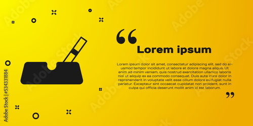 Black Ashtray with cigarette icon isolated on yellow background. Vector