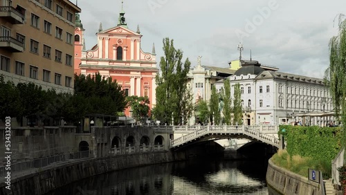 Triple bridge in Ljubljana. An ensemble of three pedestrian bridges across the Ljubljanica River in the historical center of Ljubljana. City square and Preseren square. photo