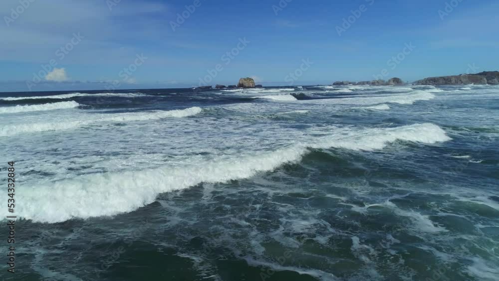 Aerial view of crashing waves on Oregon coastline.
Aerial view of crashing waves on Oregon coastline.