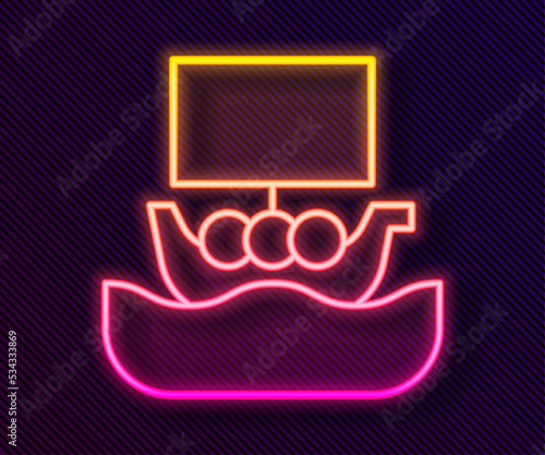 Glowing neon line Ancient viking scandinavian drakkar icon isolated on black background. Viking transport ship. Vector