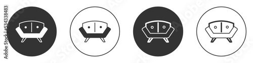 Black Sofa icon isolated on white background. Circle button. Vector