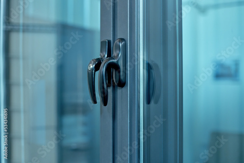 close-up. metal handle on the glass door.