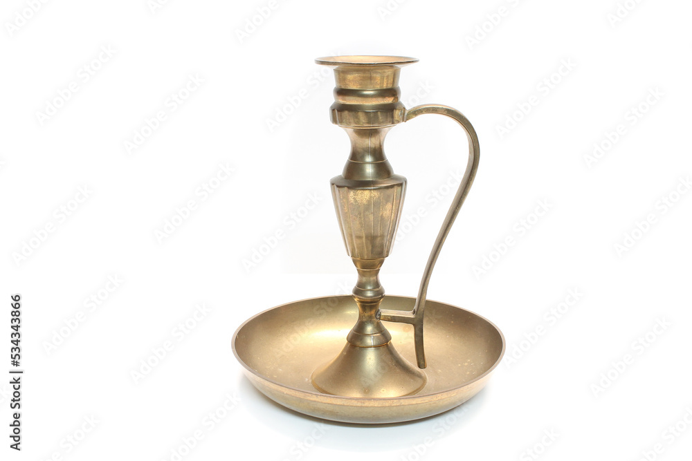 Old, brass, ornate candlestick candle holder, shiny, but with light patina, isolated on a white background. 