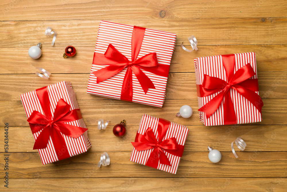 Christmas gift boxes on wooden background, top view Christmas gift boxes on wooden background, top view
