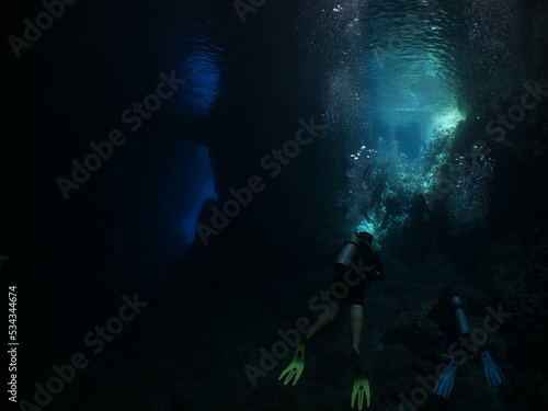 sun beam and rays sun shine underwater in caves and caverns backgrounds scuba divers to explore