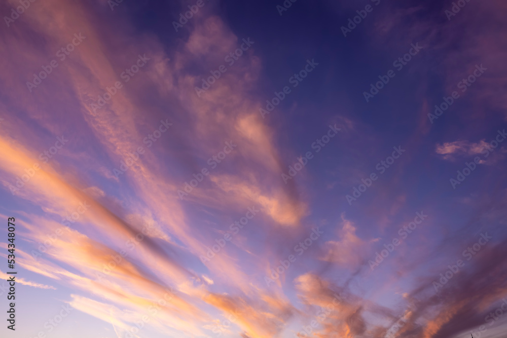 Fototapeta premium A beautiful dusk sky with pink colours and soft sunlight as a background or texture