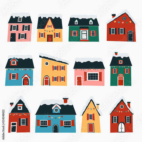 Set of cute winter houses. Cozy little cottages in a flat style. Cartoon Christmas vector illustration.