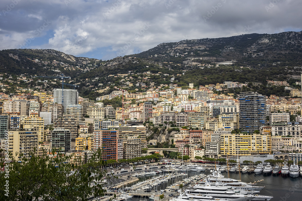 Beautiful panoramic view on Monaco at daytime with Hercules Port (Port Hercule). Principality of Monaco, French Riviera, Western Europe.