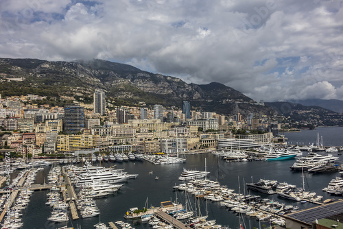 Beautiful panoramic view on Monaco at daytime with Hercules Port (Port Hercule). Principality of Monaco, French Riviera, Western Europe. © dbrnjhrj