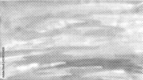 Grunge halftone background. Comic pixelated texture. Abstract dotted wallpaper. White and black canvas. Vector  photo