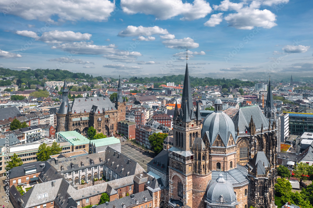 Aachen (Germany) skyline summer panorama. Aerial view of Aachen Cathedral (German: Aachener Dom) with Katschhof square and Town Hall (Rathaus) in background
