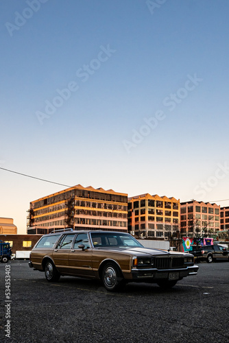 Flashy old car at an industrial park during sunset © Vincent