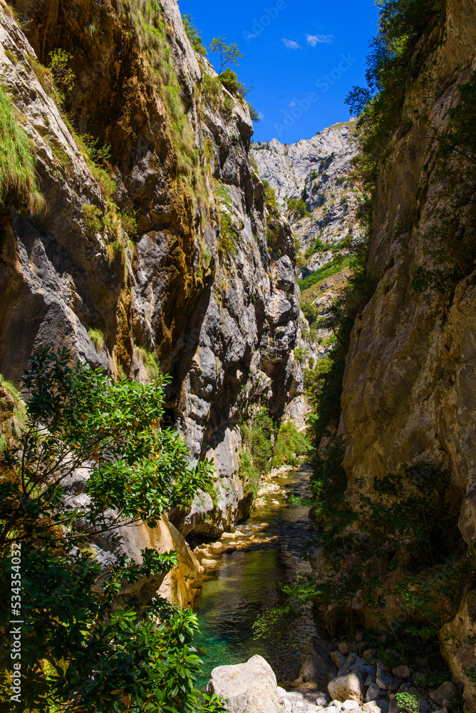 Cares river gorge route. Hiking trail in Picos de Europa National Park, Spain. Mountain path between impressive cliffs