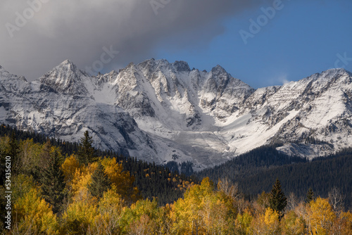 USA, Colorado, Uncompahgre National Forest. Snowy Sneffels Range and autumn forest.