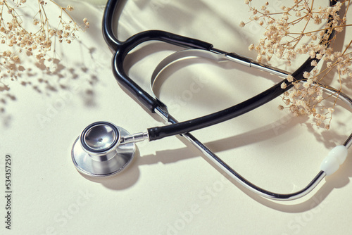 Stethoscope with natural, delicate beige background and props. Health care and medicine concept... Doctor, medic, hospital. Check my profile for more! photo