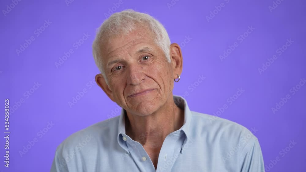 Closeup portrait of a smiling handsome middle aged man 70s. Mature caucasian man showing real emotions being happy, confident and likable. Closeup portrait of a smiling handsome middle aged man 70s. Mature caucasian man showing real emotions being happy, confident and likable.
