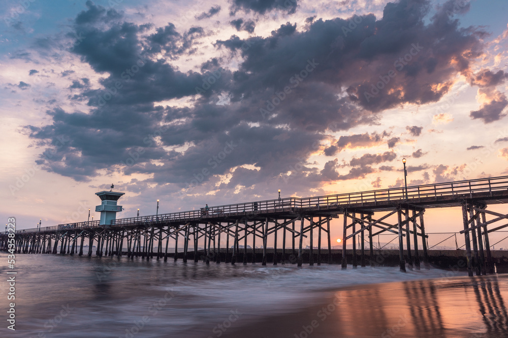 Big Puffy Clouds in Sky at Sunset Over the Seal Beach Pier