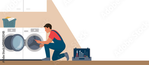 Professional repairman fixing a washer