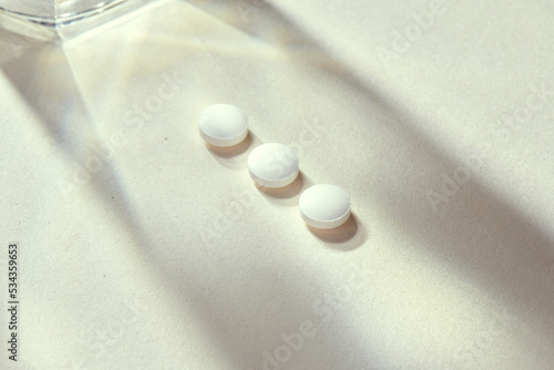 Medicine pills with natural beige background and props. Metformin, antibiotic, anti-inflammatory, antiviral or diazepam tabs. Health care and medicine concept... Check my profile for more! photo
