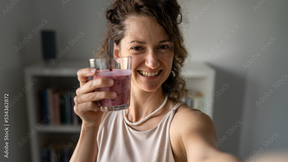 One young woman drinking healthy fruit smoothie healthy lifestyle One young woman drinking healthy fruit smoothie healthy lifestyle