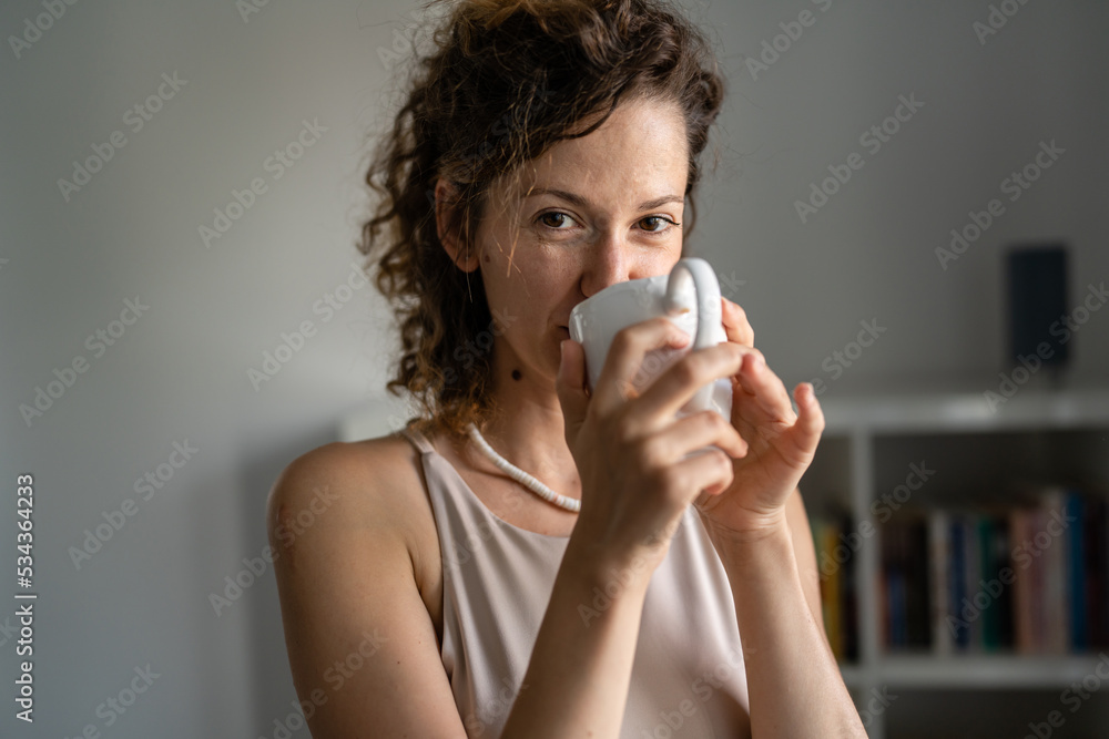 Caucasian woman businesswoman on brake in office with cup of coffee Caucasian woman businesswoman on brake in office with cup of coffee