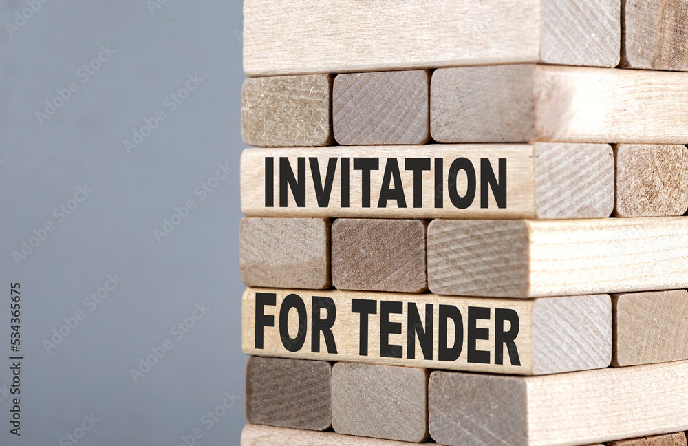 Fototapeta premium The text on the wooden blocks INVITATION FOR TENDER