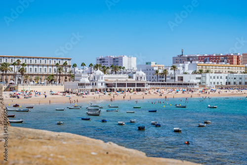 Intentional blurred wall overlooking La Caleta beach and architecture of the Our Lady de la Palma y del Real spa, Cádiz SPAIN