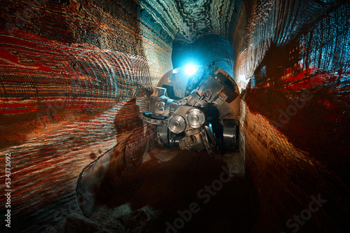 Mining drilling machine in tunnel of sylvinite salt quarry photo