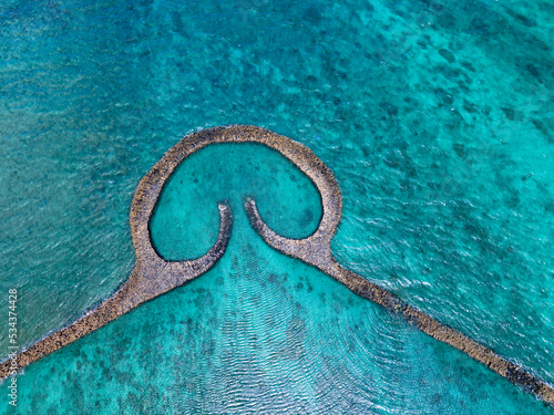 Aerial view of stone tidal weirs in Penghu, Taiwan. photo