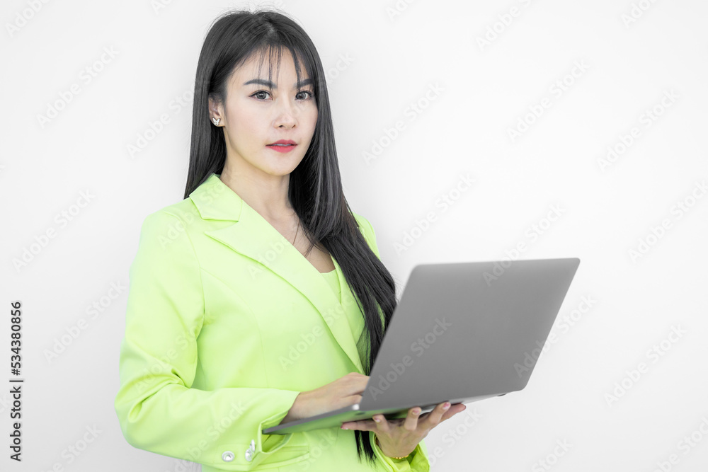 Asian businesswoman in suit working on computer laptop isolated on white background, Confident smiling happy asian businesswoman, Business, finance and employment, female successful entrepreneurs. Asian businesswoman in suit working on computer laptop isolated on white background, Confident smiling happy asian businesswoman, Business, finance and employment, female successful entrepreneurs.