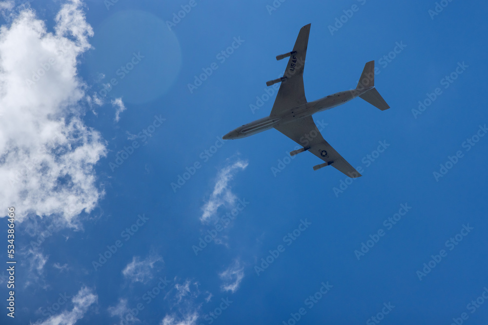 Naklejka premium U.S. Air Force military transport aircraft transports cargo at high speed