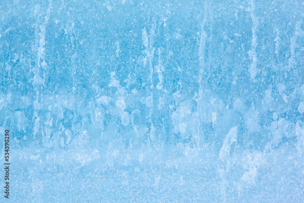 Fototapeta premium Texture of winter ice surface. Blue natural ice background