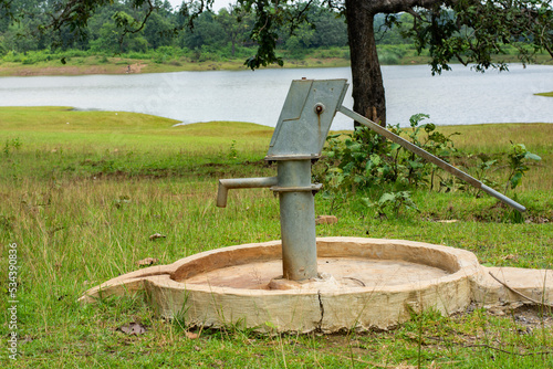 BElpahari, Jhargram, West Bengal, India: A Newly instaled Indian Hand Pump Borewell in a Rural Community in Belpahari, Jhargram. Save water concept. Selective focus. photo