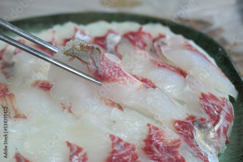 A plate full of fresh mullet sashimi