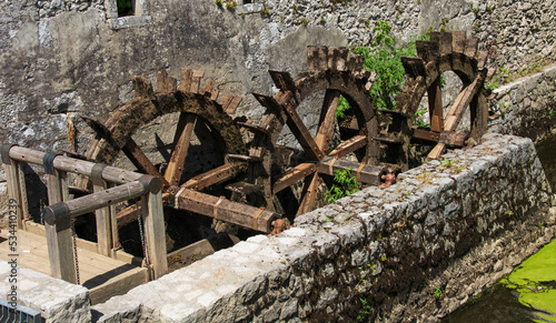 Small water wheels made of wood are no longer functional and some are defective
