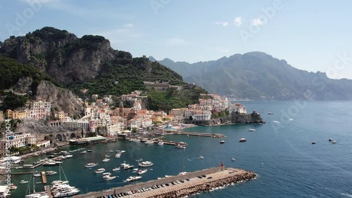 Drone flying in large circulair motion filming a village on the Amalfi coast in Italy in 4k photo