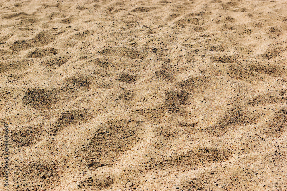 Sand on the beach for background. Brown beach sand texture as background. Close-up. Sand on the beach for background. Brown beach sand texture as background. Close-up.