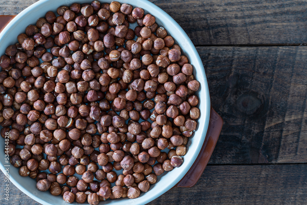 Dry hazelnuts background. Heap of peeled hazelnuts kernels Dry hazelnuts background. Heap of peeled hazelnuts kernels