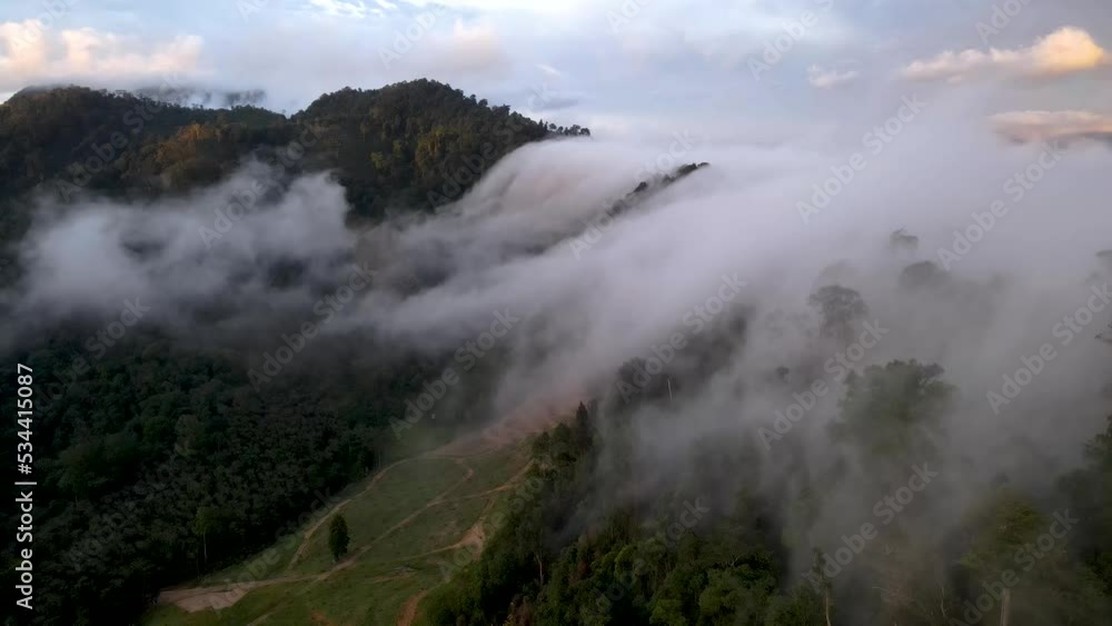 Morning mist same water fall flows over mountain forest Morning mist same water fall flows over mountain forest