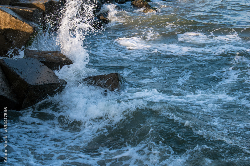 water wave on sea rocks