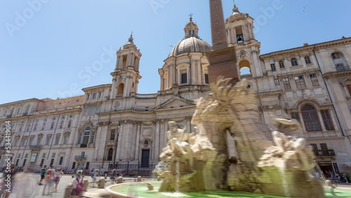 Rome, Italy: Piazza Navona with Fountain of the Four Rivers, Obelisk of Domitian and church of Sant'Agnese in Agone. Hyper lapse of famous tourist attraction and landmark, with added motion blur. photo