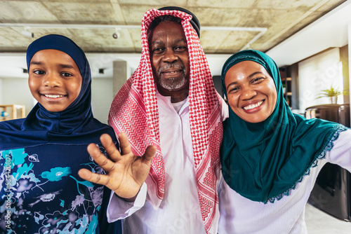 Canvas Print Arabic Family  Standing In Living Room Looking at camera