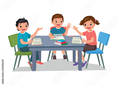 Group of elementary students kids studying together doing homework, reading, and discussing school projects around the table